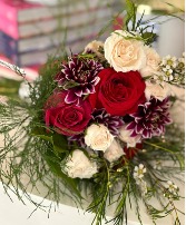 Red and white roses with a touch of purple 