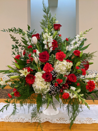 Red and White Sympathy Urn Powell Florist Featured Arrangement