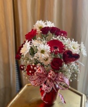 Red Hot  Red and white mix of flowers with Gerbers, roses, white daisies, and carnations.