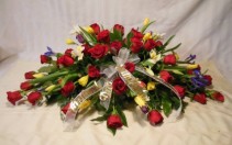RED ROSES AND SPRING FLOWERS CASKET SPRAY