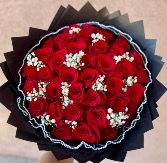 Red Roses with a touch of babies breath  