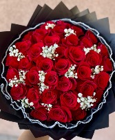 Red Roses with a touch of babies breath  