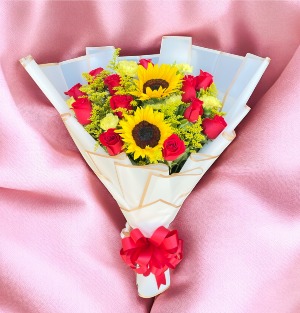 RED ROSES WRAPPED IN PAPER WITH SUNFLOWER 