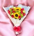 RED ROSES WRAPPED IN PAPER WITH SUNFLOWER 