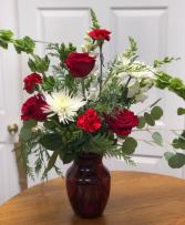 Red vase of Winter Floral Arrangement