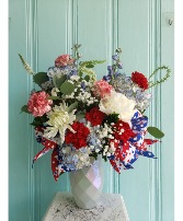RED WHITE AND BLUE FLOWER ARRANGEMENT