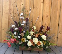 Return to Nature Sympathy arrangement in wooden log