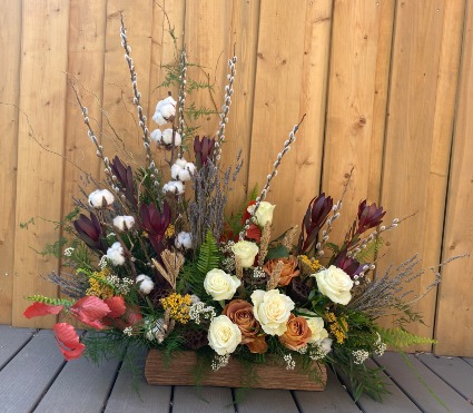 Return to Nature Sympathy arrangement in wooden log