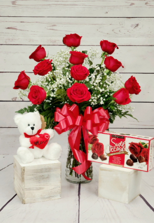 Rosebud Valentine's Day Special Dozen red roses arranged in a vase, teddy bear and a box of chocolates in Pawtucket, RI | ROSEBUD FLORIST INC.