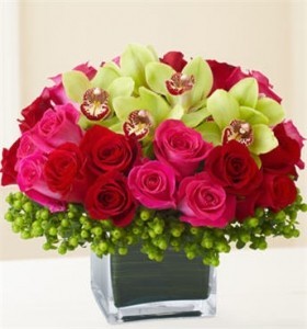 Roses and Cymbidium Orchids in a Keepsake Cube in Cape Coral, FL | ENCHANTED FLORIST OF CAPE CORAL Roses and Cymbidium Orchids in a Keepsake Cube in Cape Coral, FL | ENCHANTED FLORIST OF CAPE CORAL