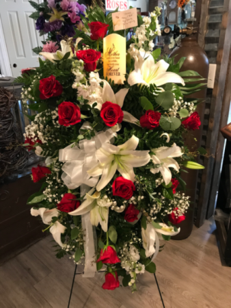 Roses and Lilly’s elegance with lighted candle  Easel spray for loved one ❤️