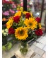 Roses and Sunflowers in a glass vase  tall arrangement 