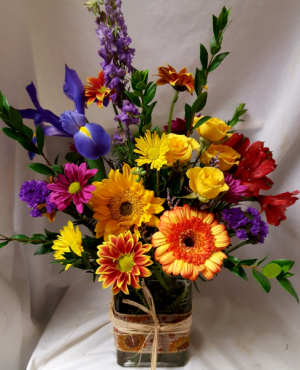 "Burst of Autumn Bouquet" seasonal mixed bright fall flowers arranged in a rectangular vase with ribbbon detail! 