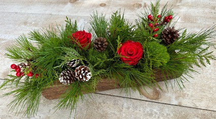 Rustic Log Holiday Centrepiece with winter greenery and everlasting roses 