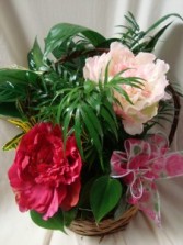 Planter with silk pink peonies and bow. Nice  keepsake for someone to take home after services.