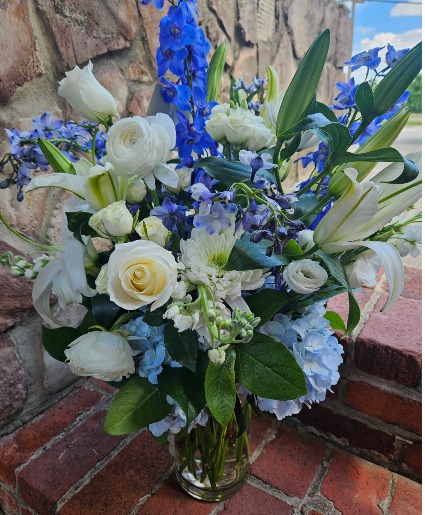 Send the pretty blues Fresh flowers in glass vase