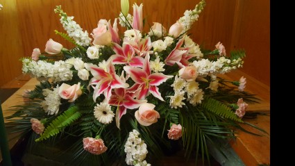 SWEET MEMORIES Half Casket Spray of pinks and whites. Stargazer Lillies, pink roses, snap dragons, carnations and more (NOTE: LILLIES need 1 week notice to open)