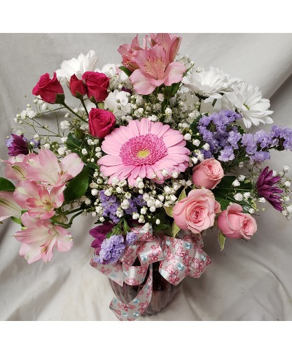 Shades of pinks arrangement...flowers may be  Different According to stock. 