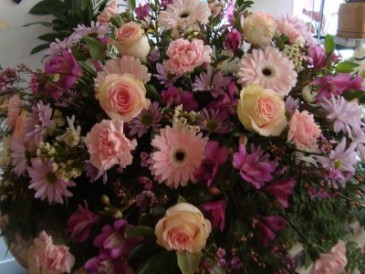 ETERNAL PEACE Half Casket Spray of pinks,purples and lavenders. Roses, Gerbera Daisies, daisies,carnations and more.