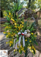 Silk themed fish grapevine wreath on easel  