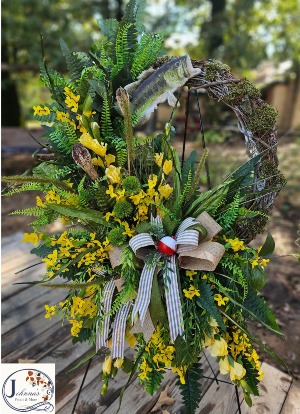 Silk themed fish grapevine wreath on easel  