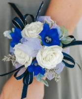 Spray roses and delphinium corsage  Wristlet corsage 