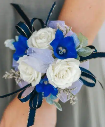 Spray roses and delphinium corsage Wristlet corsage