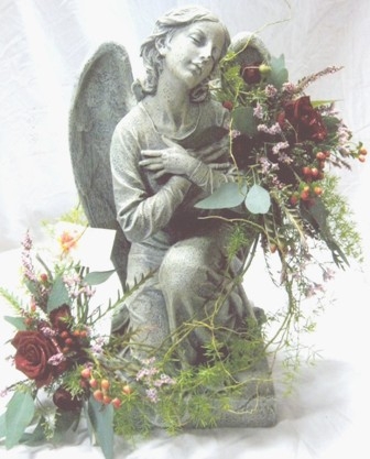 STATUE + FLOWERS We have a large selection of statuary for indoors and outdoors (in season). Allow us to decorate your choice with complimenting flowers and greens. Call for our current selection and pricing.