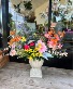 Stylish silk flower arrangement Premium silk flowers  in a neutral cement pedestal container