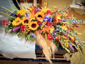 A Harvesting of Treasure Memories Casket Spray  Sympathy