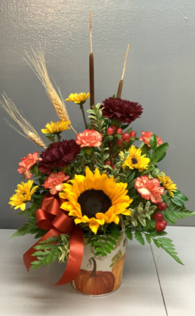 Sunflower in pumpkin tin