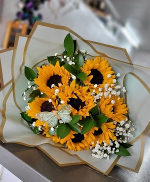 Sunflowers and baby's breath wrapped bouquet  Any occasion 