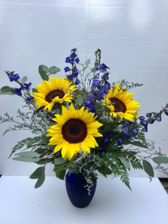 Sunflower Elegance Beautiful combinations of Sunflowers and Delphinium in Clearwater, FL | FLOWERAMA Sunflower Elegance Beautiful combinations of Sunflowers and Delphinium in Clearwater, FL | FLOWERAMA