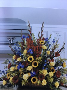 Sunflowers, yellow roses, red glads and iris Basket arrangement