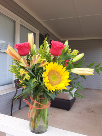 sunny and hot pink medium size vase of sunflowers and hot pink roses