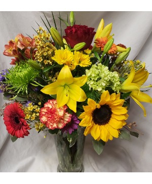 SUNNY SUNSET...Mixed flowers seasonal bright In a vase..(some flowers are in and out of stock) but flower look will be as similar as possible. 