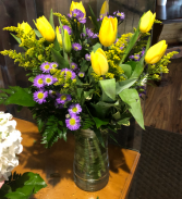 sunny tulips in a clear vase