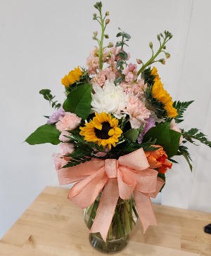 Sunshine for Mom Mixed florals in a vase with sunflowers.