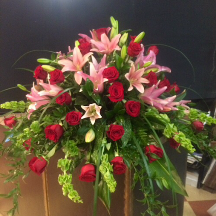 Sweet Sorrow Roses and lilies casket spray