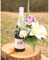 sweetness  bottle with flowers attatched