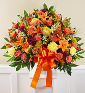 sympathy mixed in  fall colors floral arrangement