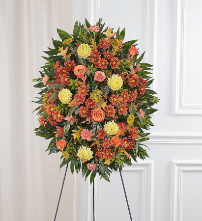 sympathy standing spray in fall colors floral arrangement