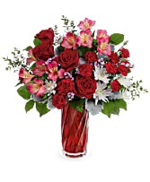 t24v100 Celebrate the splendor of true love with this radiant red rose bouquet, presented to perfection in a shimmering art glass vase with stunning swirling shape.