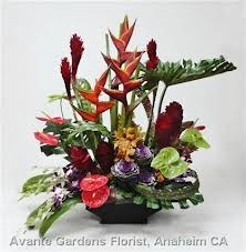 TA-11- Tropical flowers in a modern arrangement Flowers and colors may vary