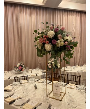 Tall centerpiece on a Harlow  Flowers 