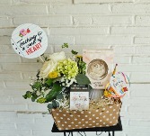 Teacher gift bundle with floral arrangement 