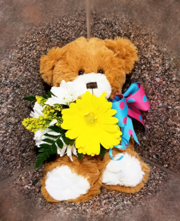 teddy bear holding flowers