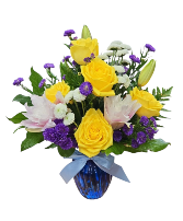 Teddy's Blue Haven Yellow roses and lily in the blue vase