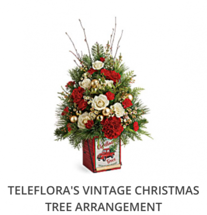 Teleflora’s Vintage Christmas Tree Arrangement  Fresh arrangement in a collectible tin