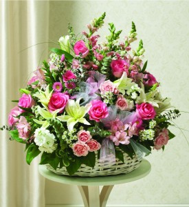TENDER THOUGHTS ARRANGEMENT SEASONAL FLOWERS IN WICKER BASKET OF PINKS AND WHITES